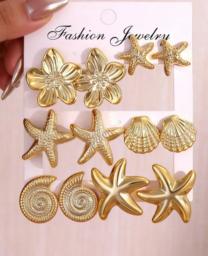 Set de aretes dorados de playa concha y estrella